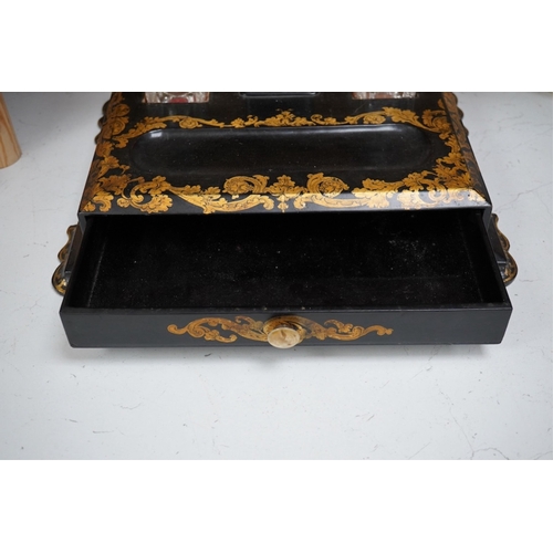 1350 - A Victorian black lacquer and gilt decorated two bottle inkstand with drawer. 36cm sided x 28cm deep... 