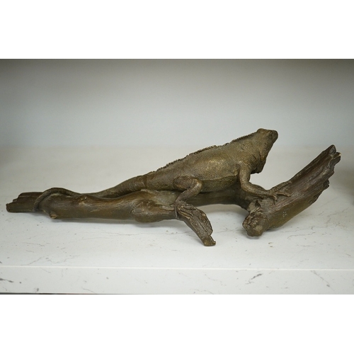 1354 - A bronze of an Iguana on a branch, 33cm long. Condition - good.