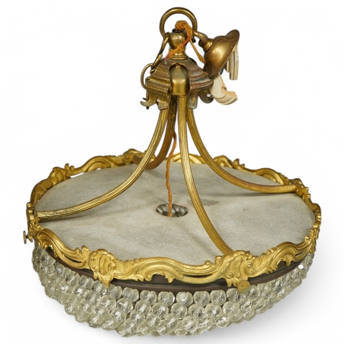 1375 - An ormolu and glass drop bag chandelier. Condition - some drops missing/loose