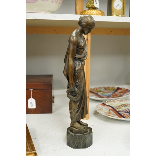 1379 - An early 20th century bronze figure of a classical maiden holding a laurel wreath, 46cm high. Condit... 