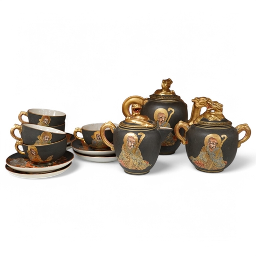 1384 - A Japanese Satsuma pottery enamel decorated tea set with Kwannon and rakan, teapot and cover 18cm hi... 