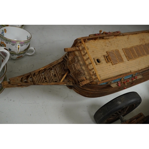 1391 - A scratch built model of a ship and a toy racing car and driver, ship 89cm wide. Condition - poor... 