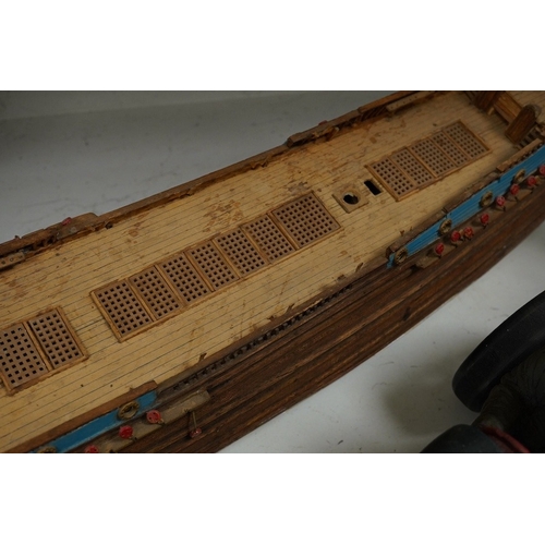 1391 - A scratch built model of a ship and a toy racing car and driver, ship 89cm wide. Condition - poor... 