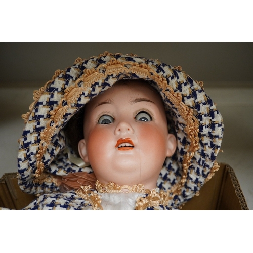 1393 - A stamped, Trebor Germany 22, bisque headed, open mouthed doll. 60cm long. Condition - fair to good... 