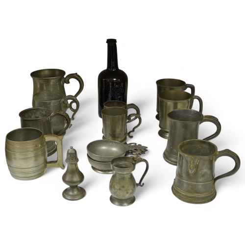 1397 - A collection of 18th and 19th century pewter mugs and other items including a 19th century wine bott... 