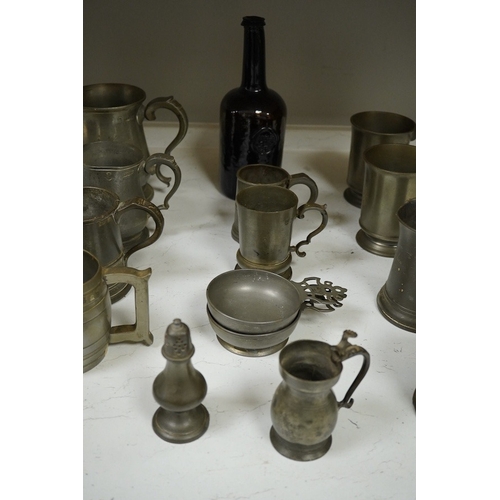 1397 - A collection of 18th and 19th century pewter mugs and other items including a 19th century wine bott... 