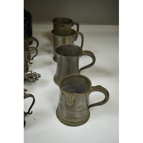 1397 - A collection of 18th and 19th century pewter mugs and other items including a 19th century wine bott... 