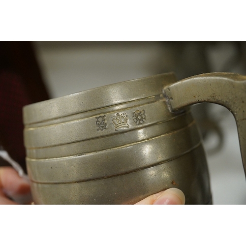 1397 - A collection of 18th and 19th century pewter mugs and other items including a 19th century wine bott... 