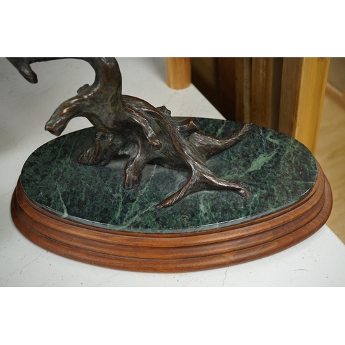 1398 - A modern large cast bronze sculpture of two flying geese, on an oval plinth, 90cm wide. Condition - ... 