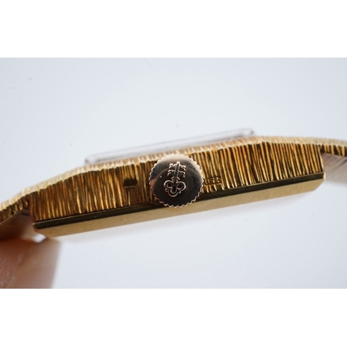 1945 - A lady's 1960's 18ct gold manual wind bracelet watch, overall length 16.5cm, gross weight 37.1 grams... 