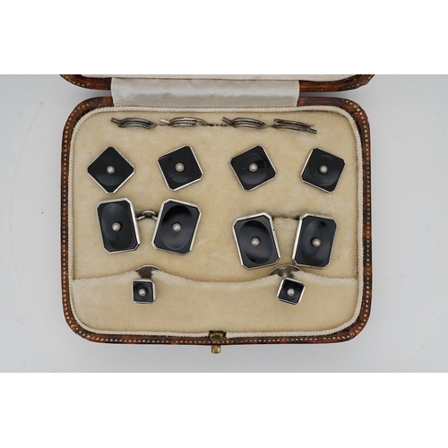 902 - A cased early 20th century, sterling, black onyx and seed pearl set eight piece dress stud set, toge... 