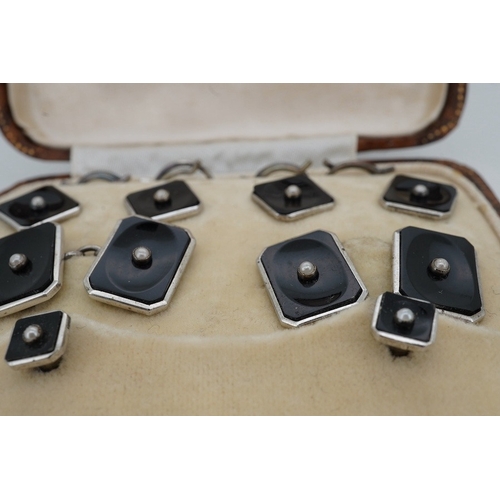 902 - A cased early 20th century, sterling, black onyx and seed pearl set eight piece dress stud set, toge... 