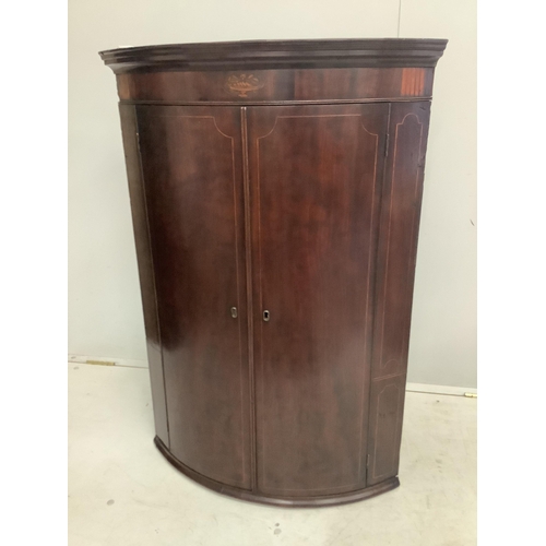 35 - A George III inlaid mahogany bow front hanging corner cupboard, width 74cm, depth 50cm, height 107cm... 