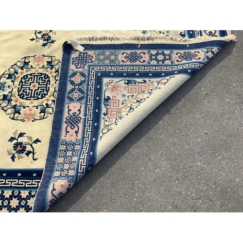 1078 - A Chinese ivory ground rug, 244 x 156cm. Condition - fair