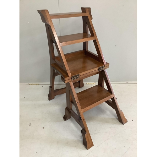 1091 - A reproduction Victorian style hardwood metamorphic library chair, width 42cm, height 84cm. Conditio... 