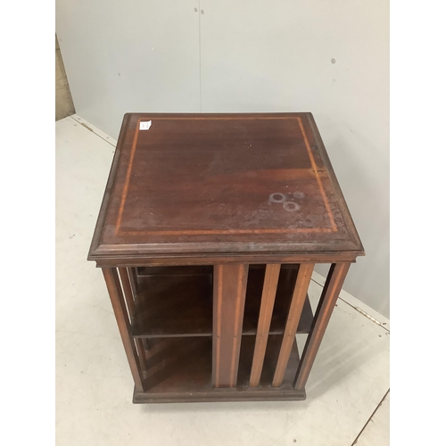 1106 - An Edwardian satinwood banded mahogany revolving bookcase, width 55cm, depth 55cm, height 82cm. Cond... 