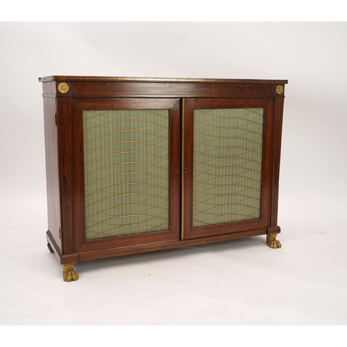 1141 - A Regency ormolu mounted rosewood and mahogany side cabinet, with brass front top and two silk pleat... 