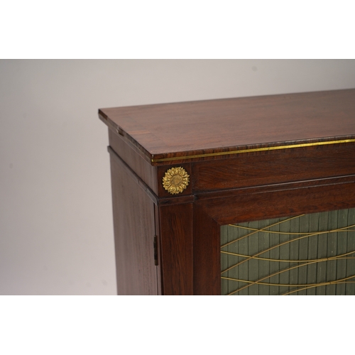 1141 - A Regency ormolu mounted rosewood and mahogany side cabinet, with brass front top and two silk pleat... 