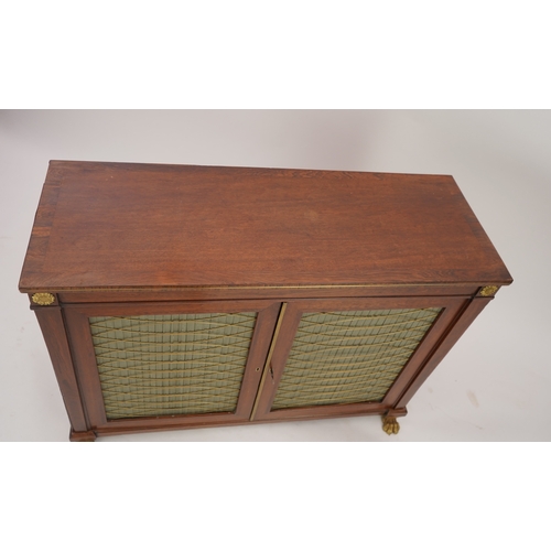 1141 - A Regency ormolu mounted rosewood and mahogany side cabinet, with brass front top and two silk pleat... 