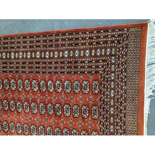 143 - A Bokhara red ground carpet, 410 x 310cm. Condition - good