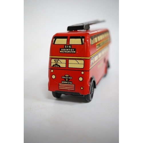 379 - A boxed Wells Brimtoy tinplate clockwork trolley bus loosely in London Transport livery, together wi... 