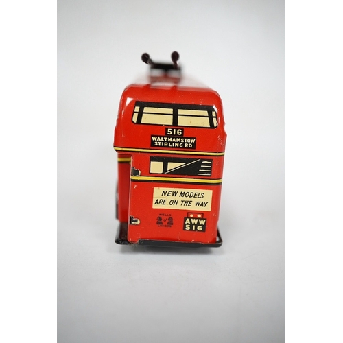 379 - A boxed Wells Brimtoy tinplate clockwork trolley bus loosely in London Transport livery, together wi... 