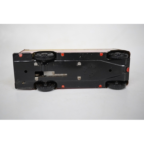 379 - A boxed Wells Brimtoy tinplate clockwork trolley bus loosely in London Transport livery, together wi... 