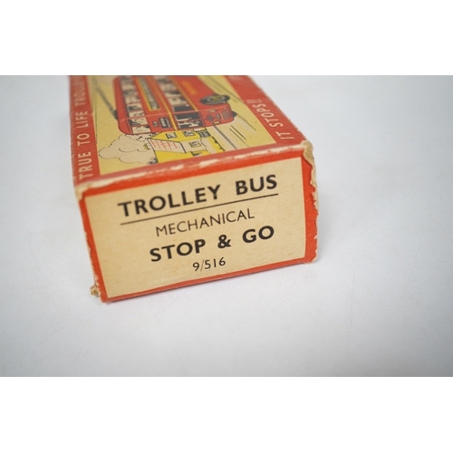 379 - A boxed Wells Brimtoy tinplate clockwork trolley bus loosely in London Transport livery, together wi... 