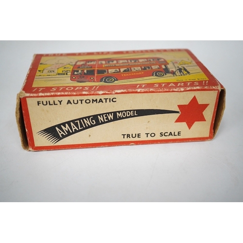379 - A boxed Wells Brimtoy tinplate clockwork trolley bus loosely in London Transport livery, together wi... 