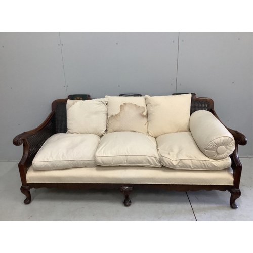 110 - An early 20th century part painted walnut three piece bergere suite, settee width 186cm, depth 78cm,... 