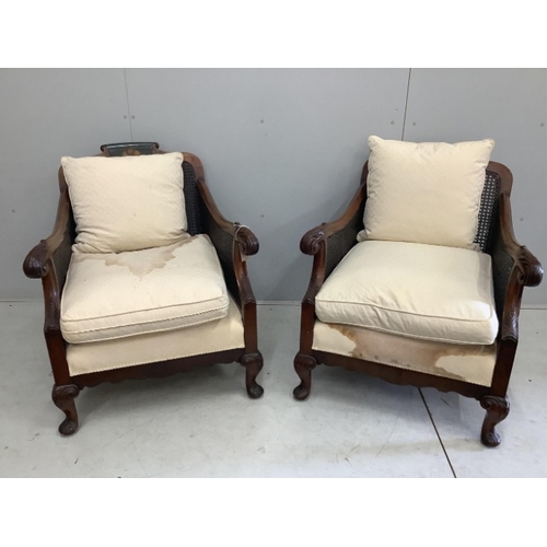 110 - An early 20th century part painted walnut three piece bergere suite, settee width 186cm, depth 78cm,... 