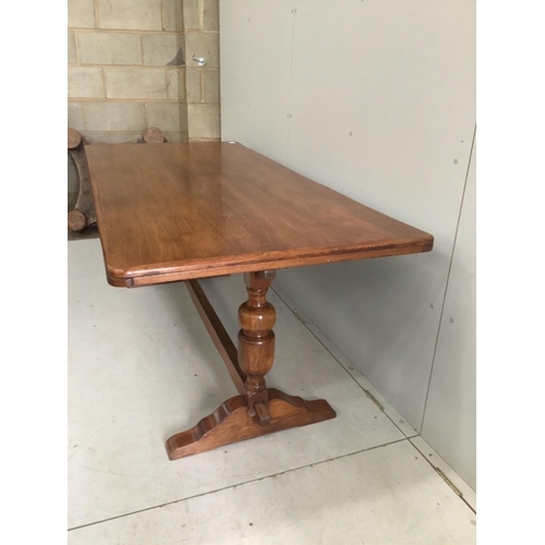 111 - An 18th century style rectangular oak refectory dining table, width 182cm, depth 83cm, height 71cm t... 