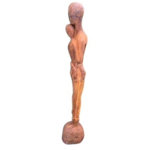 24 - A cast iron embracing couple garden ornament, height 126cm