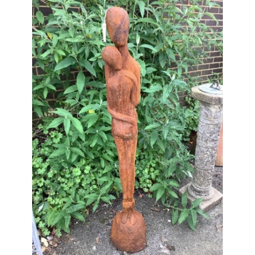 24 - A cast iron embracing couple garden ornament, height 126cm