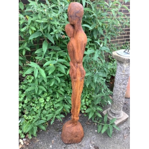 24 - A cast iron embracing couple garden ornament, height 126cm