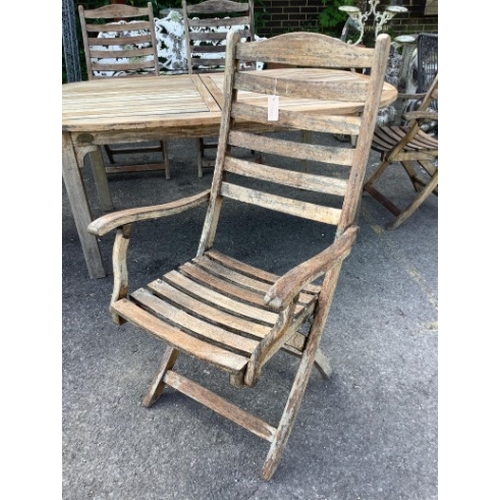 28 - A weathered slatted teak Nova extending garden table, width 240cm extended, depth 100cm, height 71cm... 