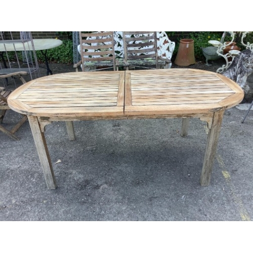 28 - A weathered slatted teak Nova extending garden table, width 240cm extended, depth 100cm, height 71cm... 