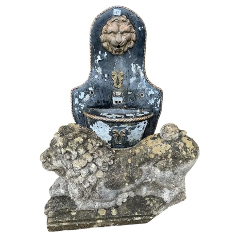 67 - A reconstituted stone recumbent lion and ram garden ornament, length 60cm, together with a painted c... 
