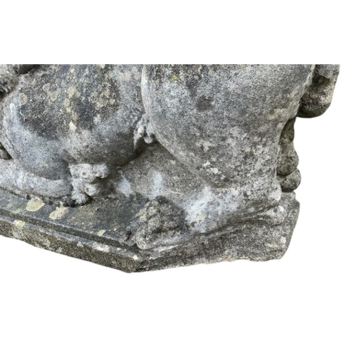 67 - A reconstituted stone recumbent lion and ram garden ornament, length 60cm, together with a painted c... 