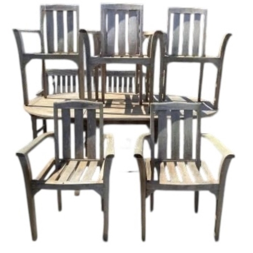 75 - Six Sherwood teak elbow chairs, a weathered teak oval extending garden table, 181cm extended, depth ... 