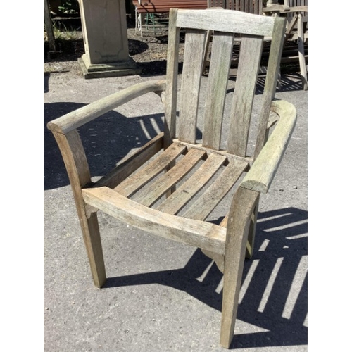 75 - Six Sherwood teak elbow chairs, a weathered teak oval extending garden table, 181cm extended, depth ... 