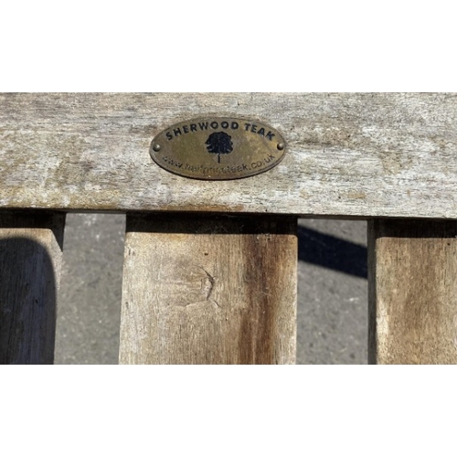 75 - Six Sherwood teak elbow chairs, a weathered teak oval extending garden table, 181cm extended, depth ... 