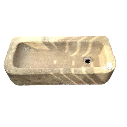 77 - A 19th century carved sandstone trough, width 84cm, height 43cm