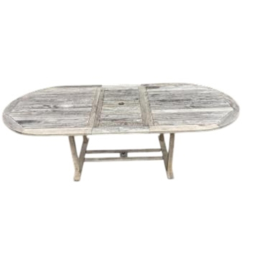 79 - A weathered teak oval extending garden table, width 239cm extended, depth 109cm, height 73cm togethe... 