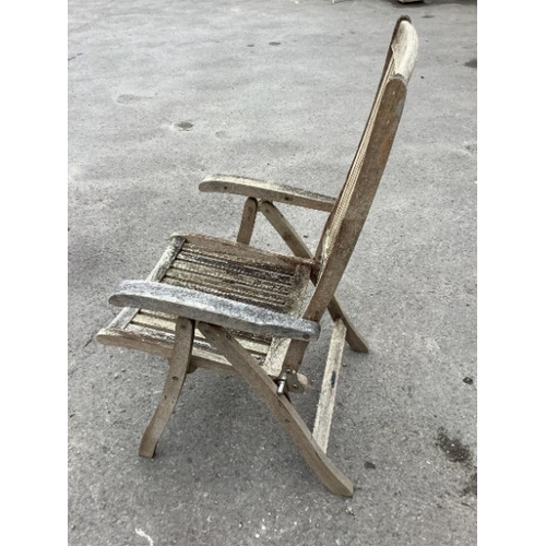 79 - A weathered teak oval extending garden table, width 239cm extended, depth 109cm, height 73cm togethe... 