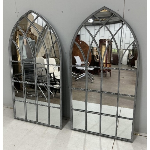 84 - A pair of modern Gothic style arched window frame style wall mirrors, width 71cm, height 138cm