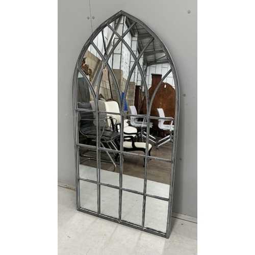 84 - A pair of modern Gothic style arched window frame style wall mirrors, width 71cm, height 138cm