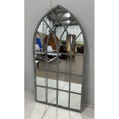 84 - A pair of modern Gothic style arched window frame style wall mirrors, width 71cm, height 138cm