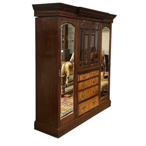 108 - A late Victorian carved mahogany mirrored wardrobe, width 208cm, depth 60cm, height 218cm