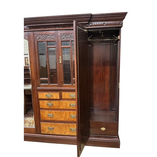 108 - A late Victorian carved mahogany mirrored wardrobe, width 208cm, depth 60cm, height 218cm